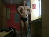 Tim Budesheim poses and flexes